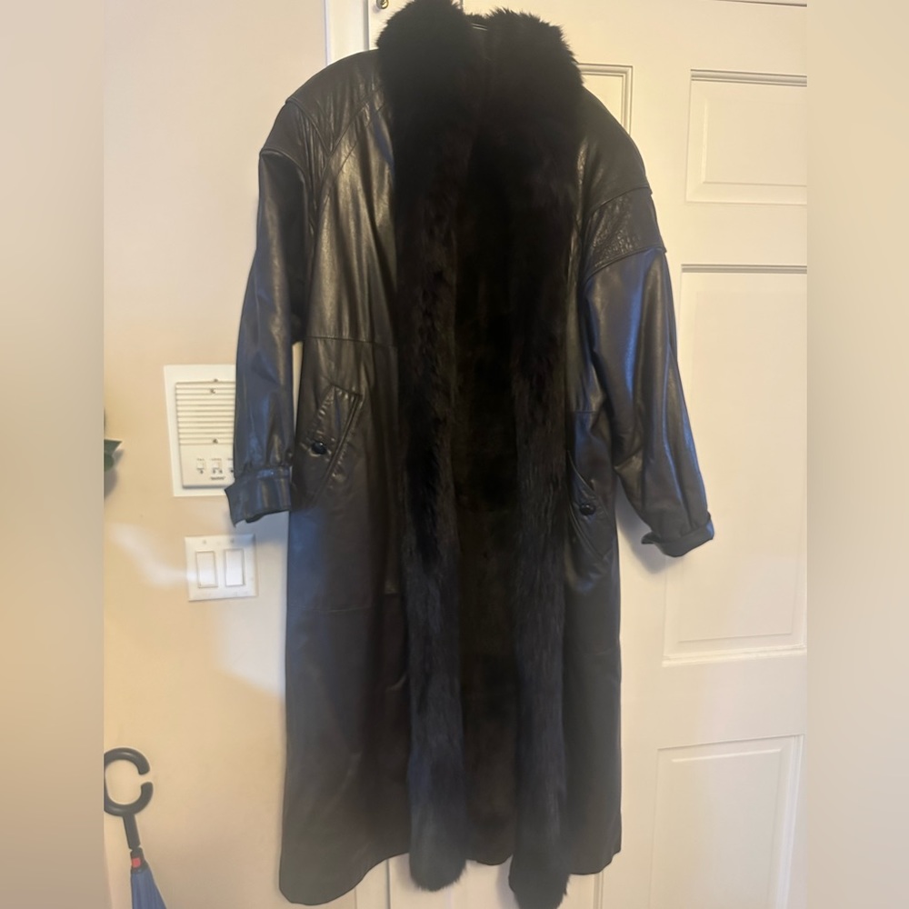 Vintage leather coat with fox fur trim. Lined with sheer ed fox inside!